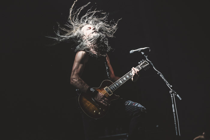 Epica guitarist caught in high contrast, high speed light.