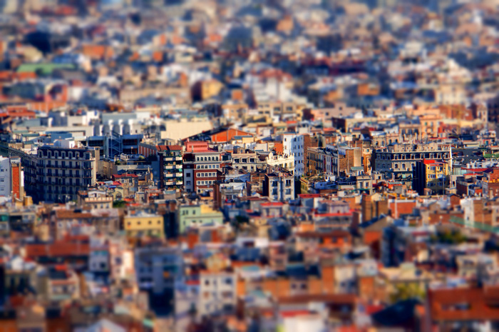 An overhead shot of a sprawling cityscape shot with a tilt shift lens