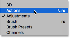 Selecting the Actions panel from under the Window menu. Image © 2016 Photoshop Essentials.com