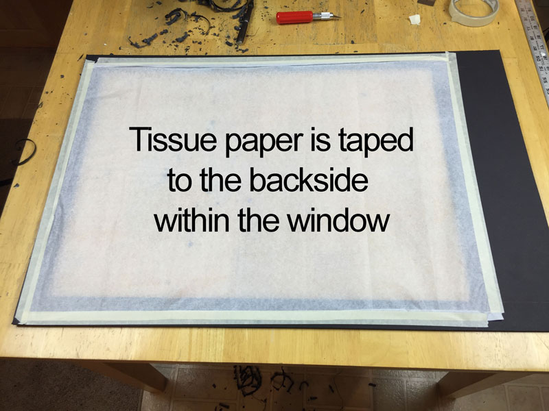 Tissue paper adhered to the back of the top window
