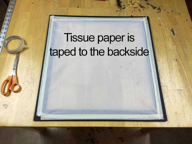 Tissue paper is adhered in place